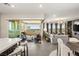 Open-concept design showcases the kitchen, living, and balcony spaces at 9145 Las Manaitas Ave # 401, Las Vegas, NV 89144