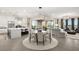 Open-concept living space features modern kitchen, dining, and living areas at 9145 Las Manaitas Ave # 401, Las Vegas, NV 89144