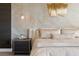 Close up of the main bedroom with a decorative wall and modern furniture at 9145 Las Manaitas Ave # 401, Las Vegas, NV 89144