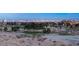 Scenic view of the Las Vegas skyline at dusk, framed by trees and desert landscape at 9145 Las Manaitas Ave # 401, Las Vegas, NV 89144