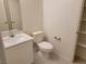 Cozy half bathroom with sleek vanity, bright lighting, and neutral-toned walls at 9159 Oxford Blue Ave, Las Vegas, NV 89148