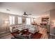 Open concept living room with sectional sofa and kitchen view at 926 Hidden Bull St, Las Vegas, NV 89178