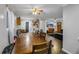 Dining area with a rustic wood table and chairs, view of living room at 934 Lewis Ct, Henderson, NV 89015