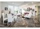 Elegant living room boasts white furniture and a herringbone floor at 2818 Belmont Dr, Henderson, NV 89074