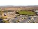 Aerial view of community athletic fields and parking with scenic desert views at 10397 Station Creek Cir, Las Vegas, NV 89178