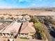 Aerial view showcasing a single-story house with a tile roof and a small backyard at 10397 Station Creek Cir, Las Vegas, NV 89178