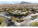 Stunning aerial view of The Club at Yellowstone featuring pools, clubhouse, and desert landscape at 10397 Station Creek Cir, Las Vegas, NV 89178