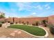 Artificial turf, landscaping, and rock features in backyard at 10397 Station Creek Cir, Las Vegas, NV 89178