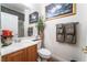 Bathroom with wood cabinets and neutral color scheme at 10397 Station Creek Cir, Las Vegas, NV 89178