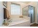 Relaxing bathroom with a soaking tub and walk-in shower at 10397 Station Creek Cir, Las Vegas, NV 89178