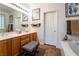 Bathroom with double vanity, large mirror, and separate tub and shower at 10397 Station Creek Cir, Las Vegas, NV 89178