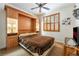 Bedroom with built-in murphy bed and wood cabinets at 10397 Station Creek Cir, Las Vegas, NV 89178