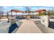 Charming play area featuring shaded coverings and a miniature town layout for imaginative play at 10397 Station Creek Cir, Las Vegas, NV 89178