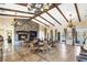 Elegant club room with a cozy fireplace and dining tables, perfect for gatherings at The Club at Yellowstone at 10397 Station Creek Cir, Las Vegas, NV 89178