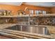 Modern kitchen sink and faucet with granite countertop at 10397 Station Creek Cir, Las Vegas, NV 89178
