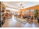 Spacious living room with a stone fireplace and open floor plan at 10397 Station Creek Cir, Las Vegas, NV 89178