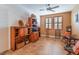 Home office with built-in wooden shelving and cabinetry at 10397 Station Creek Cir, Las Vegas, NV 89178