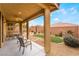 Covered patio with seating area, overlooking the backyard at 10397 Station Creek Cir, Las Vegas, NV 89178