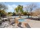 Pool and spa with lounge chairs at 10397 Station Creek Cir, Las Vegas, NV 89178