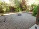 Landscaped backyard with fire pit and gravel ground cover at 11173 Hickory Glen St, Las Vegas, NV 89179
