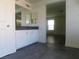 Bathroom with dark vanity and tiled floor at 11173 Hickory Glen St, Las Vegas, NV 89179