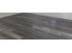 Grey wood-look floor in a bright bedroom at 11173 Hickory Glen St, Las Vegas, NV 89179