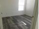 Bright bedroom with grey wood-look floor at 11173 Hickory Glen St, Las Vegas, NV 89179