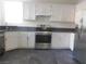 White kitchen cabinets, stainless steel appliances at 11173 Hickory Glen St, Las Vegas, NV 89179