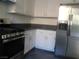 Kitchen features white cabinets and stainless steel appliances at 11173 Hickory Glen St, Las Vegas, NV 89179