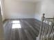 Spacious living room with grey wood-look floors at 11173 Hickory Glen St, Las Vegas, NV 89179