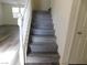 Stairs with gray wood-look treads and white railing at 11173 Hickory Glen St, Las Vegas, NV 89179