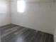 Large walk-in closet with wood-look floors and hanging rods at 11173 Hickory Glen St, Las Vegas, NV 89179