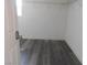 Spacious walk-in closet with wood-look floors and hanging rods at 11173 Hickory Glen St, Las Vegas, NV 89179