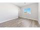 Bright bedroom with grey vinyl flooring and access to bathroom at 1280 E Carson, Pahrump, NV 89048