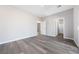 Bright bedroom with grey vinyl flooring and access to a bathroom and closet at 1280 E Carson, Pahrump, NV 89048