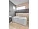 Bathroom featuring a freestanding soaking tub and modern fixtures at 1341 Villa Barolo Ave, Henderson, NV 89052