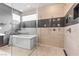 Spa-like bathroom with a walk-in shower and a soaking tub at 1341 Villa Barolo Ave, Henderson, NV 89052