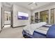 Comfortable bedroom with a large TV and plenty of natural light at 1341 Villa Barolo Ave, Henderson, NV 89052