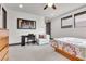 Spacious bedroom with a built-in desk and comfortable seating area at 1341 Villa Barolo Ave, Henderson, NV 89052