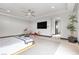Bright bedroom with a platform bed and stylish seating at 1341 Villa Barolo Ave, Henderson, NV 89052