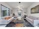 Elegant common area with plush sofas and a unique coffee table at 1341 Villa Barolo Ave, Henderson, NV 89052