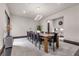 Elegant dining room featuring a long table and modern chandelier at 1341 Villa Barolo Ave, Henderson, NV 89052
