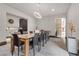 Spacious dining room features a long table and modern decor at 1341 Villa Barolo Ave, Henderson, NV 89052