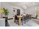 Elegant dining room with a large table and modern lighting at 1341 Villa Barolo Ave, Henderson, NV 89052
