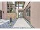 Modern entry with courtyard, stone, and glass at 1341 Villa Barolo Ave, Henderson, NV 89052