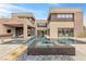 Modern home with a large pool and spa at 1341 Villa Barolo Ave, Henderson, NV 89052