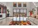 Bright living room with glass coffee table and modern art at 1341 Villa Barolo Ave, Henderson, NV 89052