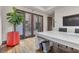 Modern home office with large windows and a spacious desk at 1341 Villa Barolo Ave, Henderson, NV 89052