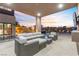 Outdoor patio with seating and TV at 1341 Villa Barolo Ave, Henderson, NV 89052