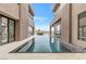 Long, rectangular pool between home wings at 1341 Villa Barolo Ave, Henderson, NV 89052